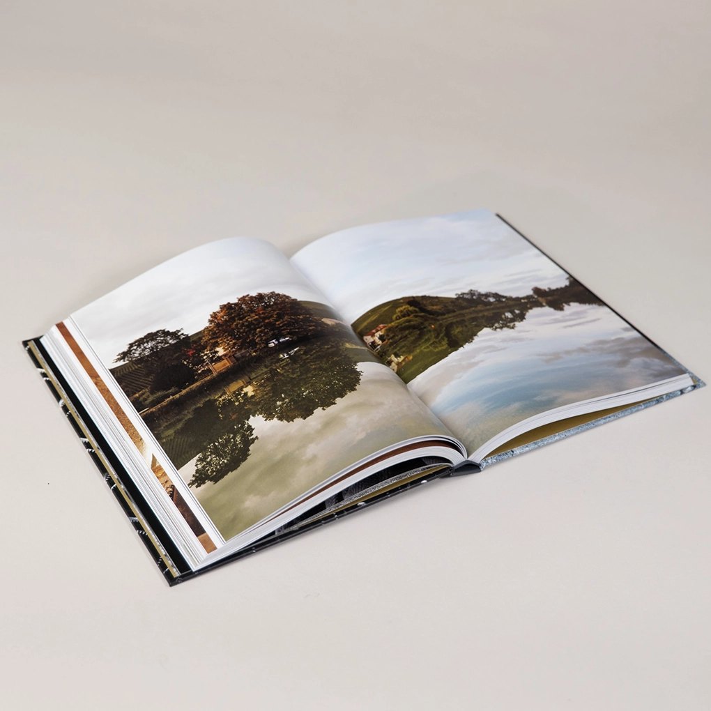 An interior spread, with a photograph of French countryside.
